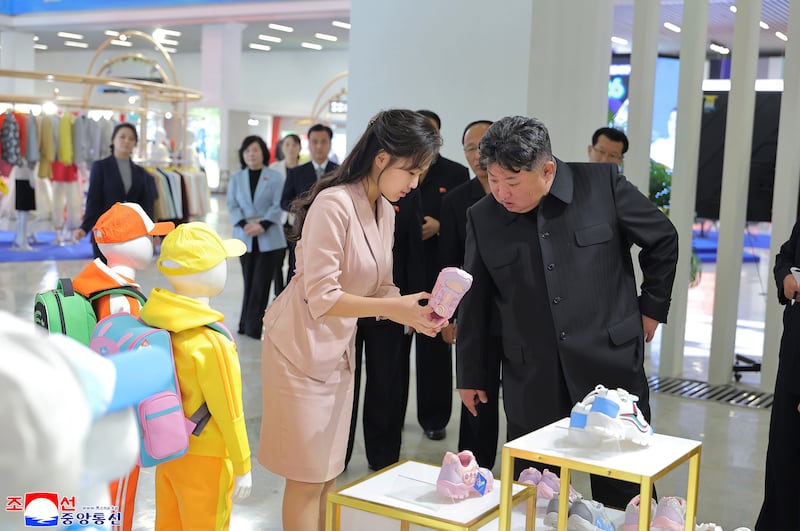 Kim Jong Un is in pictures released by state-run media with his daughter at a Pyongyang exhibition on October 19 amid rumors of his death.