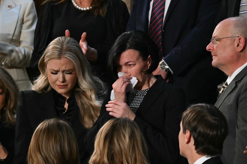 Erika Kirk, widow of the late conservative activist Charlie Kirk, looks on as Anna Zarutska, the mother of Iryna Zarutska, is recognized by US President Donald Trump during the State of the Union address.
