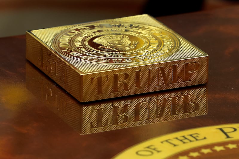 A gold drink coaster box sits on U.S. President Donald Trump's coffee table.