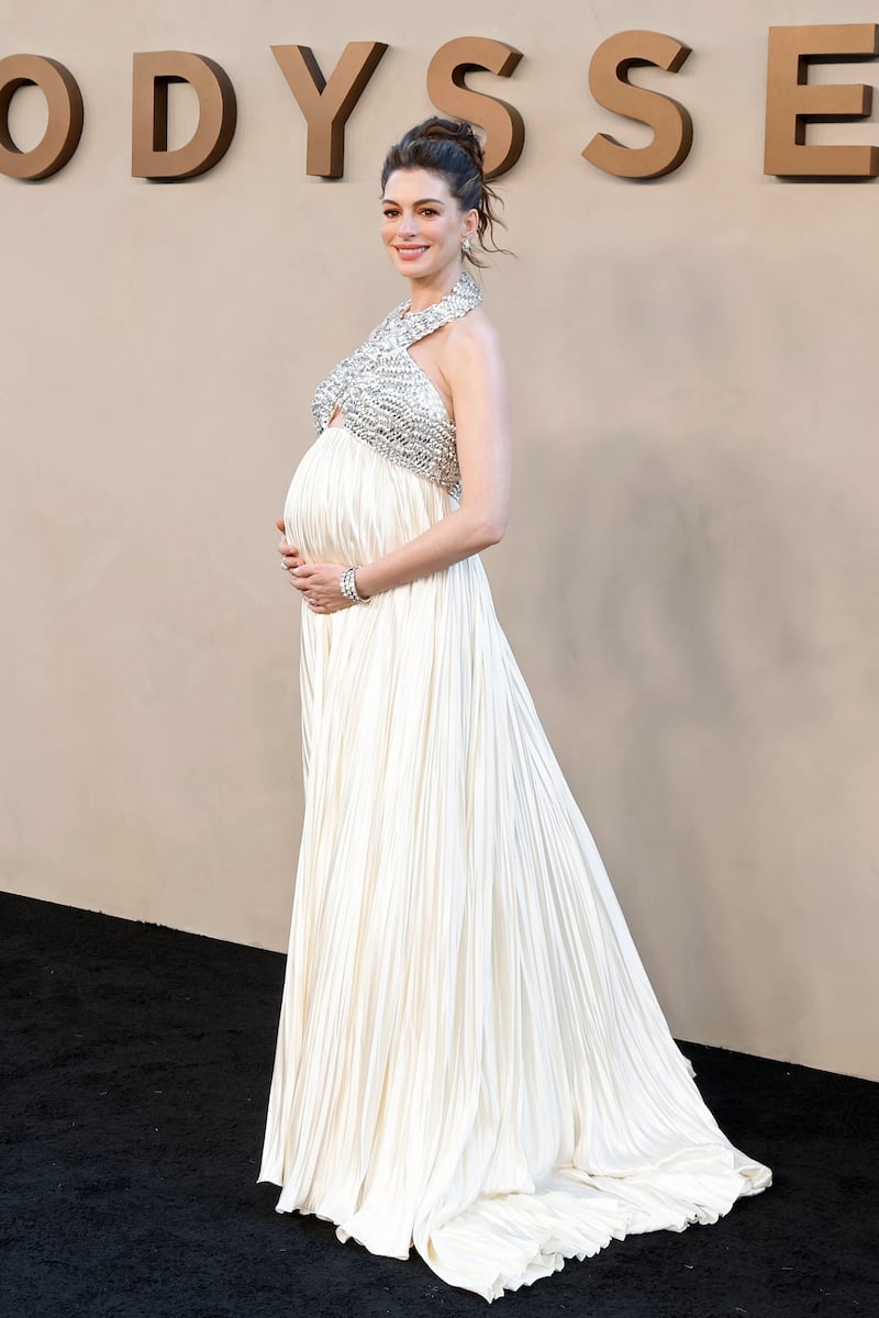 Anne Hathaway wears white gown and updo as she attends the New York premiere of "The Odyssey" at AMC Lincoln Square Theater on July 14, 2026, in New York City.