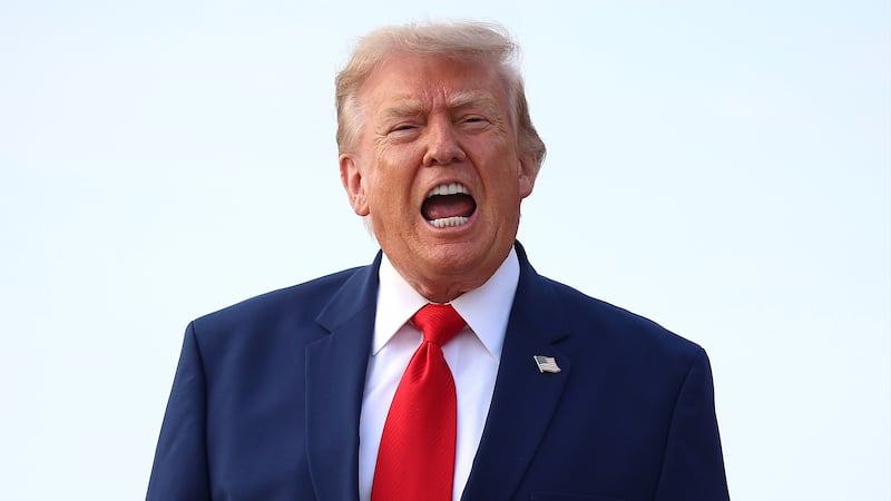 JOINT BASE ANDREWS, MARYLAND - JULY 22: U.S. President Donald Trump calls out to reporters after getting off Air Force One on July 22, 2026 at Joint Base Andrews, Maryland. Trump is returning from attending a dignified transfer at Dover Air Force Base and a rally in Georgia. (Photo by Kevin Dietsch/Getty Images)