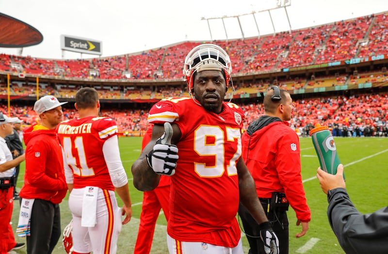 Allen Bailey #97, defensive tackle for the Kansas City Chiefs, gave a thumbs-up to teammate Dustin Colquitt in the closing minutes of the 30-13 victory over the Jacksonville Jaguars at Arrowhead Stadium on October 7, 2018, in Kansas City, Missouri.