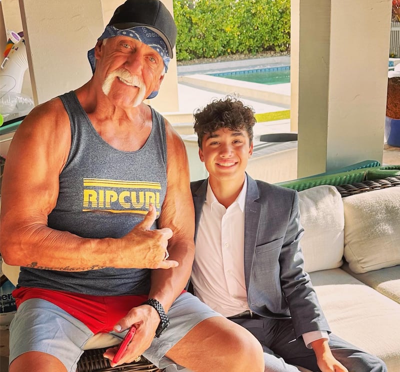 The late wrestler Hulk Hogan sits with his wife Sky Daily's son, Hayden Hitt, in an old photo on her Instagram. Daily and Hitt are now involved in multiple lawsuits over an alleged rape of a minor at a party they threw.