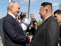 North Korean leader Kim Jong Un shakes hands with Russia's President Vladimir Putin