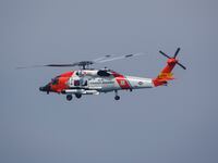 SAN DIEGO, CALIFORNIA - JUNE 28: A U.S. Coast Guard Sikorsky MH-60T Jayhawk helicopter flies to the U.S. Coast Guard Sector San Diego air station on June 28, 2025 in San Diego, California. (Photo by Kevin Carter/Getty Images)