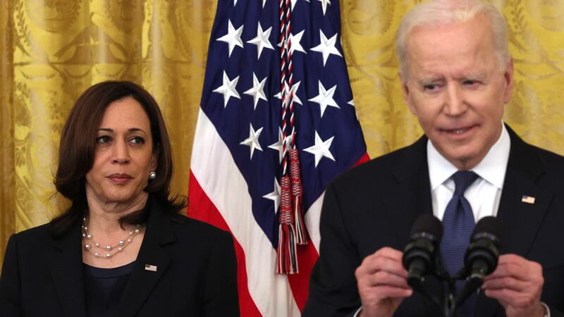 Vice President Kamala Harris listens as U.S. President Joe Biden.
