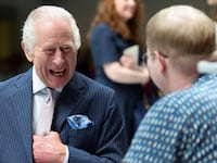 King Charles meets with patient Jasper Keech during a visit to the University College Hospital Macmillan Cancer Centre in London, Britain, April 30, 2024.