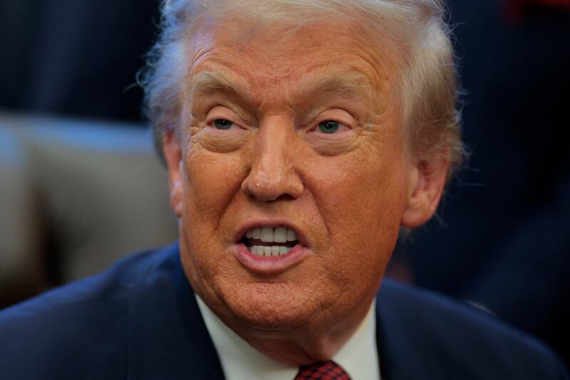 WASHINGTON, DC - DECEMBER 03: U.S. President Donald Trump speaks after announcing changes to the country's fuel economy standards in the Oval Office at the White House on December 03, 2025 in Washington, DC. Joined by executives from major automobile makers, Trump announced weaker fuel efficiency standards as part of his agenda to lower the price of gasoline-powered cars and dismantle former President Joe Biden's policies that promoted electric vehicles. (Photo by Chip Somodevilla/Getty Images)