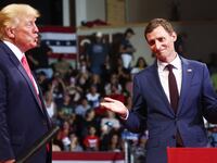 Former President Donald Trump (L) stands with Blake Masters