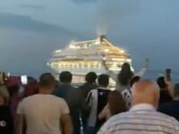 Protesters in Batumi, Georgia, cheer as the Astoria Grande cruise ship carrying Russian tourists leaves port early.