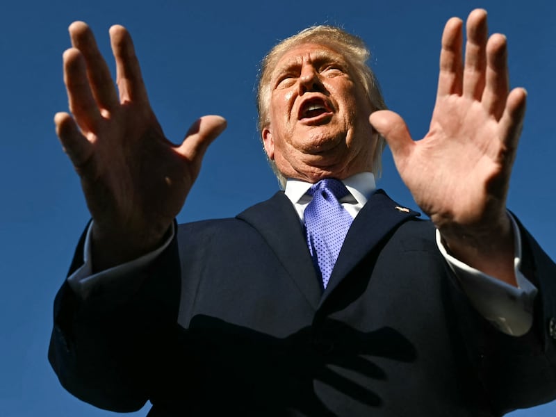 US President Donald Trump speaks to reporters after exiting Air Force One at Joint Base Andrews, Maryland on October 29, 2026. President Trump is returning to Washington, DC after speaking at a midterm campaign event in South Carolina.