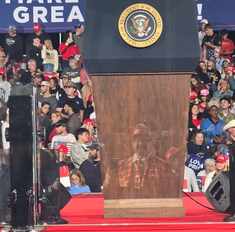 Brick Suit reflection in podium before Trump Rally in Clemson, South Carolina.