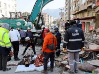 Rescuers provide medical attention to a survivor of the Turkey earthquake.