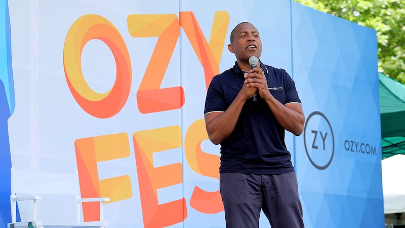A photo of Ozy founder Carlos Watson onstage at Ozy Fest.