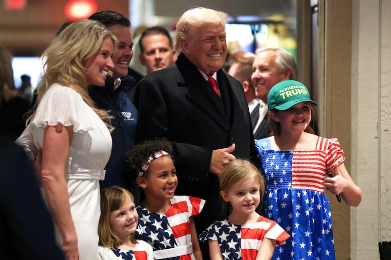 URBANDALE, IOWA - JANUARY 27: U.S. President Donald Trump poses with U.S. Rep. Zach Nunn (R-IA) and his wife Kelly Nunn as he visits the Machine Shed restaurant on January 27, 2026 in Urbandale, Iowa. President Trump is scheduled to speak later at the Horizon Events Center in Clive, Iowa. He returns to Iowa for a second time in his second term ahead of the mid-term elections. (Photo by Win McNamee/Getty Images)