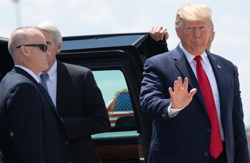 US President Donald Trump arrives to board Air Force One at Wright-Patterson Air Force Base in Ohio on August 7, 2019. - Trump and First Lady Melania Trump met with first responders, hospital staff, victims and their families, following the August 4 mass shootings in Dayton's popular Oregon District, which left nine people dead. (Photo by SAUL LOEB / AFP) (Photo credit should read SAUL LOEB/AFP via Getty Images)