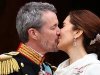 Denmark's newly proclaimed King Frederik and Queen Mary kiss on the balcony of Christiansborg Palace, following the abdication of former Queen Margrethe who reigned for 52 years, in Copenhagen, Denmark, January 14, 2024.