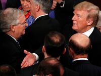 Donald Trump talks with U.S. Senate Majority Leader Mitch McConnell and Senate Majority Whip John Cornyn (L) after delivering his State of the Union address