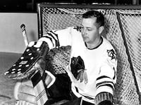 1964; Goalie Glenn Hall #1 of the Chicago Blackhawks makes a save during a portrait session circa 1964.