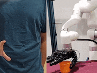 A robotic hand stacking cups.