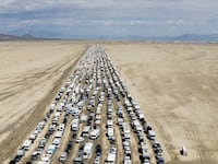 Vehicles are seen departing the Burning Man festival in Black Rock City, Nevada, U.S., September 4, 2023.