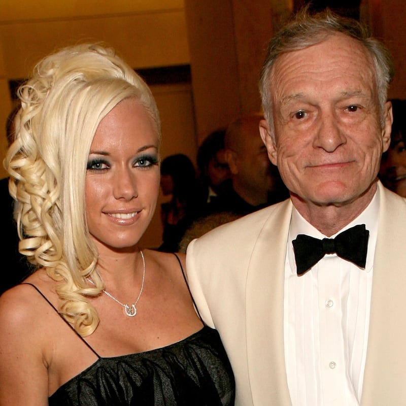 Playboy's Hugh Hefner (R) and girlfriend Playmate Kendra Wilkinson depart the 34th AFI Life Achievement Award tribute to Sir Sean Connery held at the Kodak Theatre on June 8, 2006 in Hollywood, California.