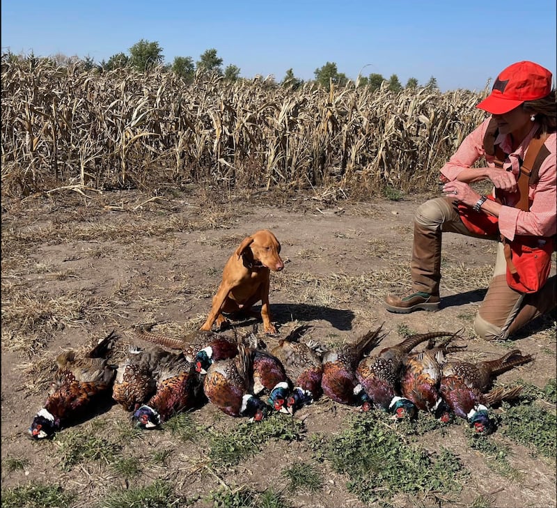 Noem and Foster with a previous pheasant haul in 2022.