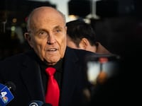 Rudy Giuliani speaks to members of the media where Republican candidate Florida Gov. Ron DeSantis was scheduled to host a campaign event on January 21, 2024 in Manchester, New Hampshire.
