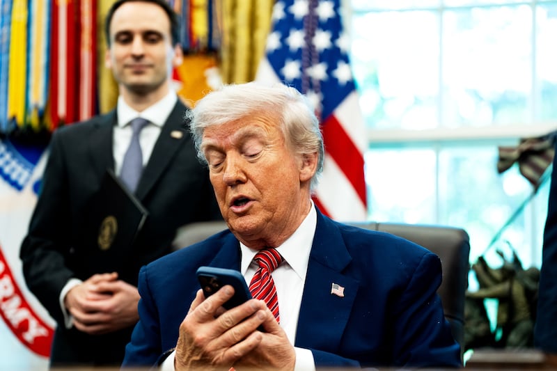 WASHINGTON, DC May 23, 2025:
US President Donald Trump silenced his cellphone in the Oval Office of the White House on Friday May 23, 2025. The executive orders were related to the nuclear power industry in the US.
(Photo by Demetrius Freeman/The Washington Post via Getty Images)