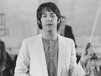 Paul McCartney records the Lennon-McCartney composition 'Thingumybob' with the Black Dyke Mills Band in Saltaire, City of Bradford, West Yorkshire, 30th June 1968.