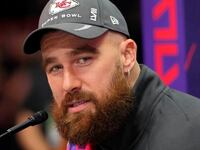 Kansas City Chiefs tight end Travis Kelce (87) talks to the media during Super Bowl LVIII Opening Night.