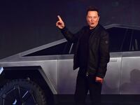 Tesla co-founder and CEO Elon Musk gestures while introducing the newly unveiled all-electric battery-powered Tesla Cybertruck in 2019.