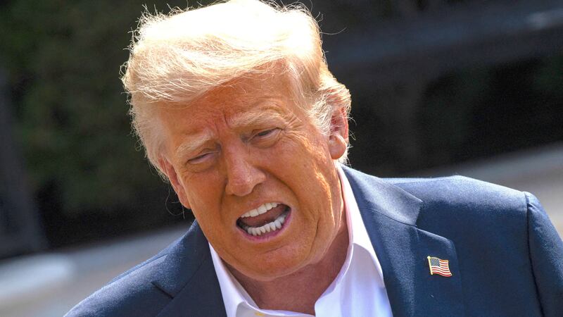 Donald Trump speaks to the press before boarding Marine One on the South Lawn of the White House in Washington, D.C., on July 11, 2025.