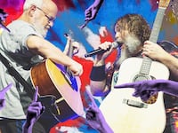 Tenacious D with fingers pointing