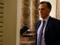 Mitt Romney speaks to a reporter in D.C.