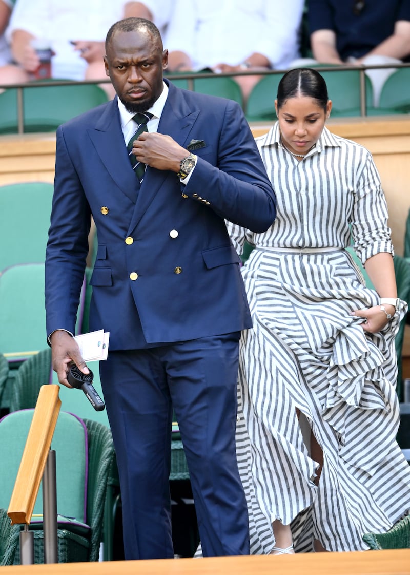 LONDON, ENGLAND - JULY 03: Usain Bolt and Kasi Bennett during day five of the 2026 Wimbledon Tennis Championships at the All England Lawn Tennis and Croquet Club on July 03, 2026 in London, England.