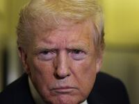 IN FLIGHT - OCTOBER 19: U.S. President Donald Trump speaks to members of the press on October 19, 2025 aboard Air Force One. The President is returning to Washington, DC, after spending his weekend at Mar-a-Lago resort in Palm Beach, Florida. (Photo by Alex Wong/Getty Images)