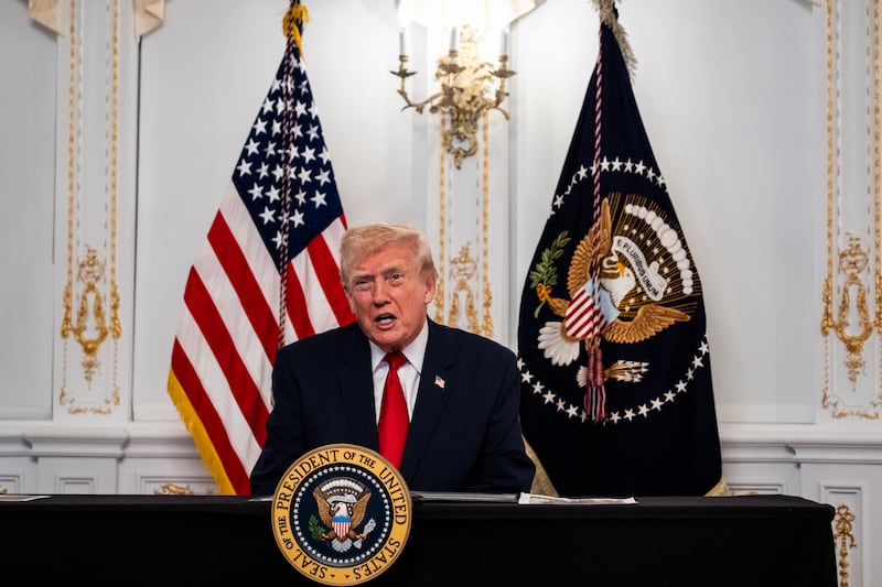 Donald Trump participates in a call with U.S. service members from his Mar-a-Lago club in Florida on Thanksgiving Day on November 27, 2025 in Palm Beach, Florida.