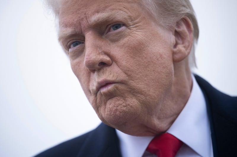 TOPSHOT - US President Donald Trump speaks to the press about the conflict in Ukraine before boarding Air Force One at Andrews Air Force Base March 14, 2025, in Maryland. Trump is spending the weekend at his Florida Mar-a-Lago resort. (Photo by Brendan Smialowski / AFP) (Photo by BRENDAN SMIALOWSKI/AFP via Getty Images)