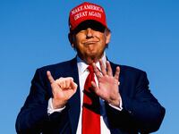 Donald Trump with his pinky finger out for a pinky promise.