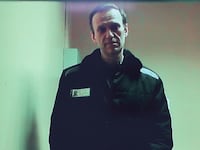Russian opposition leader Alexei Navalny is seen on a screen via video link from a penal colony in the Vladimir Region during a hearing at the Basmanny district court in Moscow