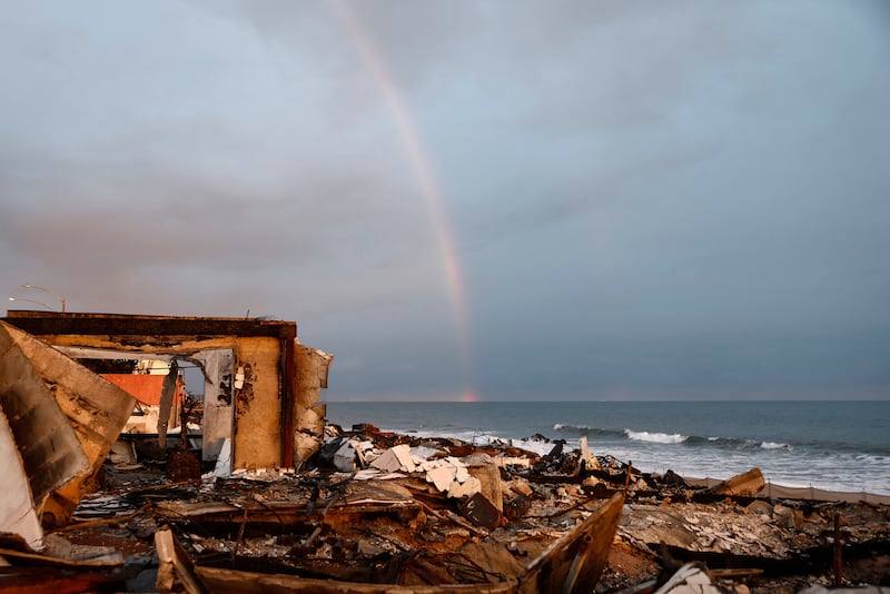 A rainbow appears over beachfront homes destroyed in the Pacific Palisades fire in Malibu, California.