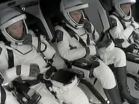 Crew-10 wait to be escorted out of the rocket following the mission’s stand down.