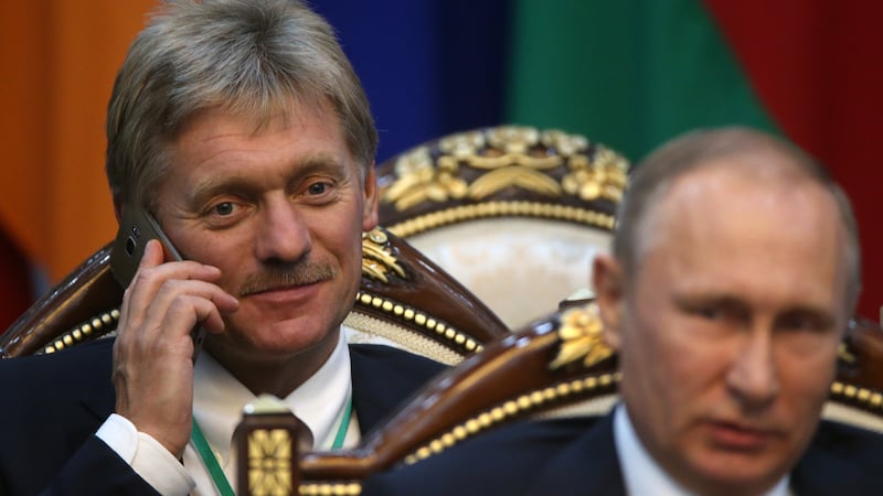 Russian President Vladimir Putin and Presidential Press Secretary Dmitry Peskov