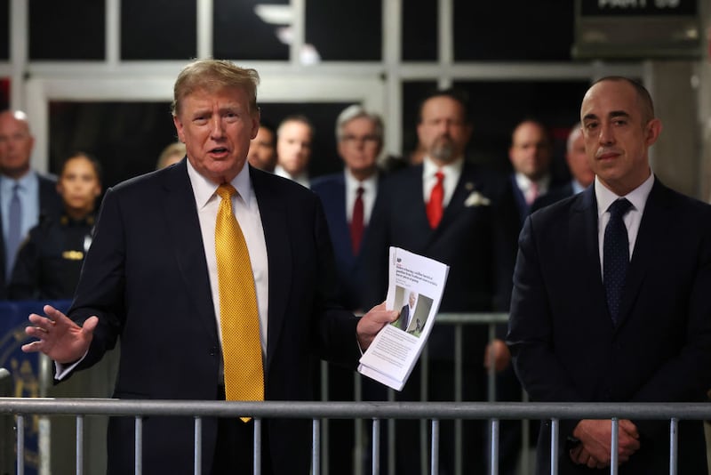 Donald Trump speaks alongside his attorney Emil Bove after a break during his hush money trial at Manhattan Criminal Court.
