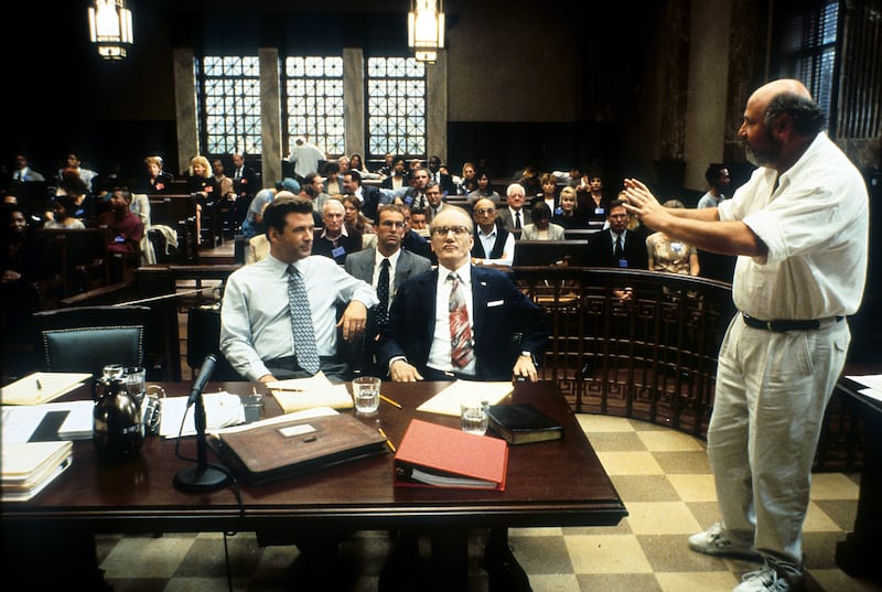 Alec Baldwin and James Woods listen to director Rob Reiner
