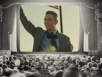 Photo illustration of Cillian Murphy in Oppenheimer in an old movie theater.