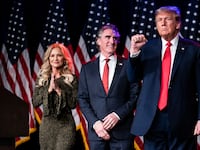 Donald Trump, flanked by North Dakota Gov. Doug Burgum and his wife, Kathryn, in Las Vegas on Feb 8, 2024.