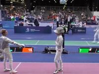 Ukrainian fencer Olga Kharlan points her blade at Russian opponent Anna Smirnova.
