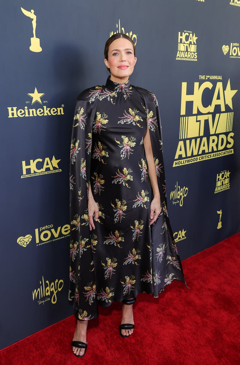 Mandy Moore wore a striking floral-print Rodarte gown to attend the HCA TV Awards: Broadcast & Cable at the Beverly Hilton on August 13, 2022, while pregnant with her second child.